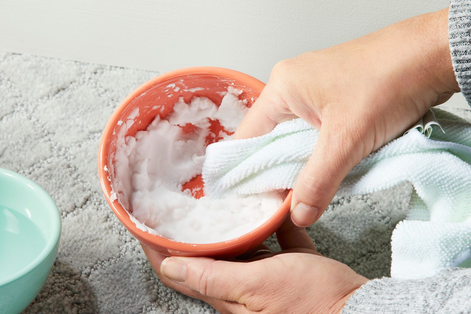 dipping moist cloth into paste