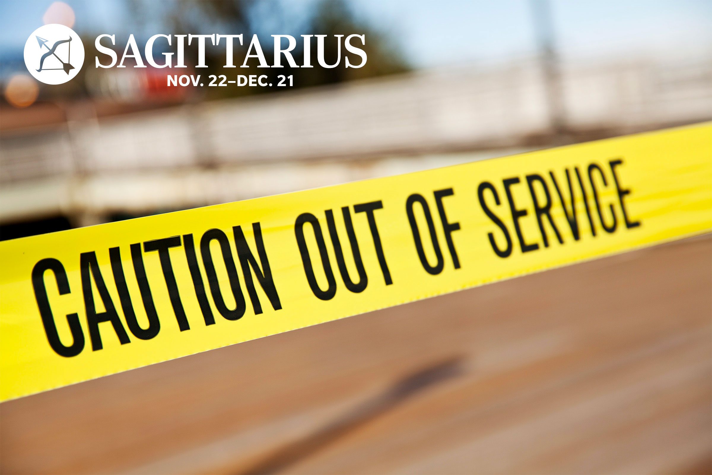 caution out of service tape with Sagittarius zodiac in upper left corner