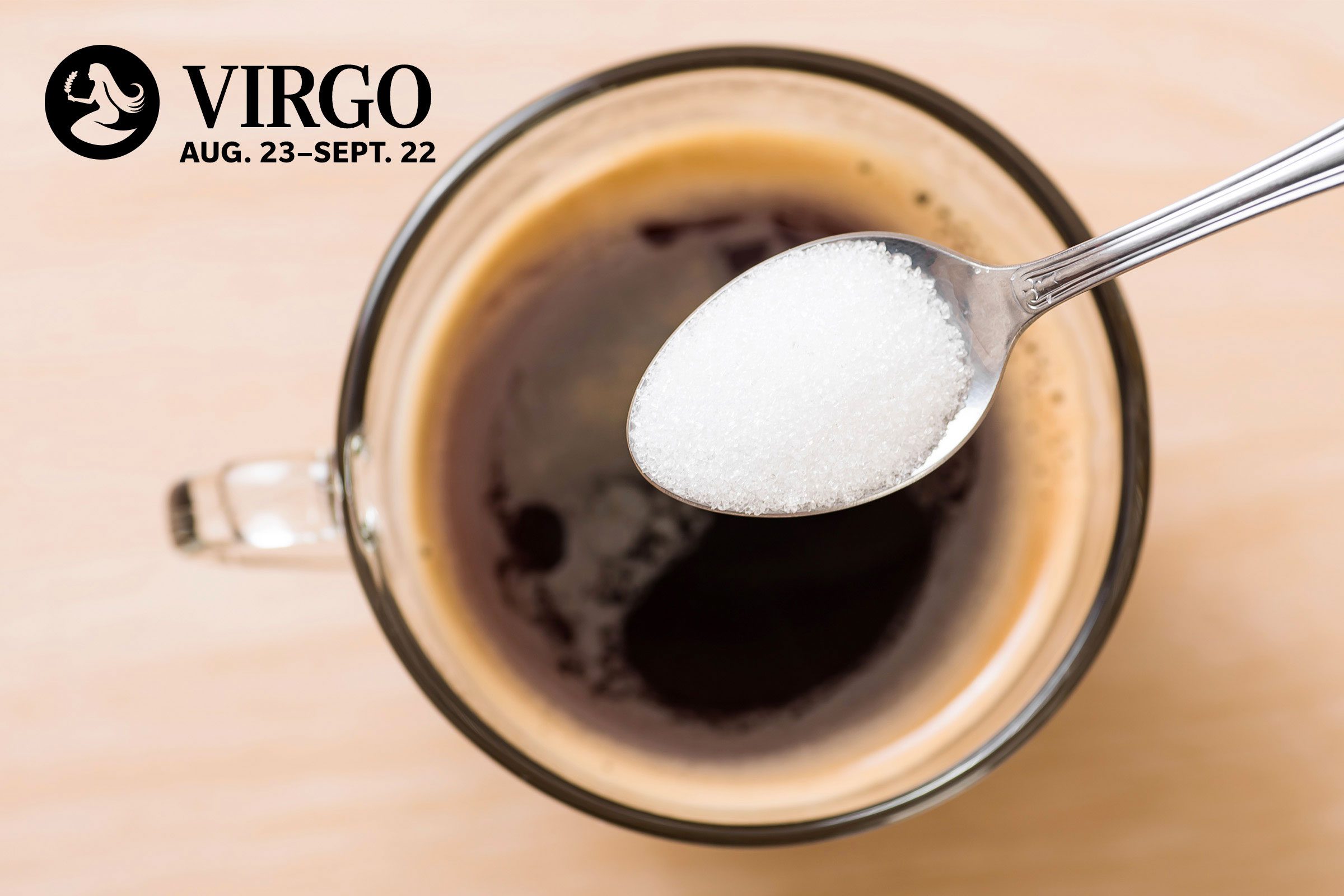 spoonful of salt going into coffee with virgo zodiac in upper left corner