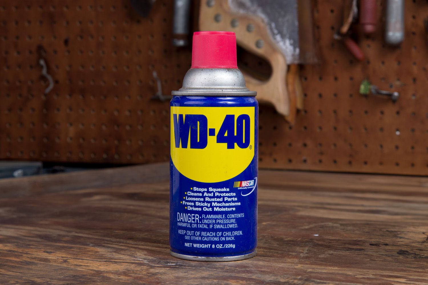 wd-40 bottle in a garage workshop environment