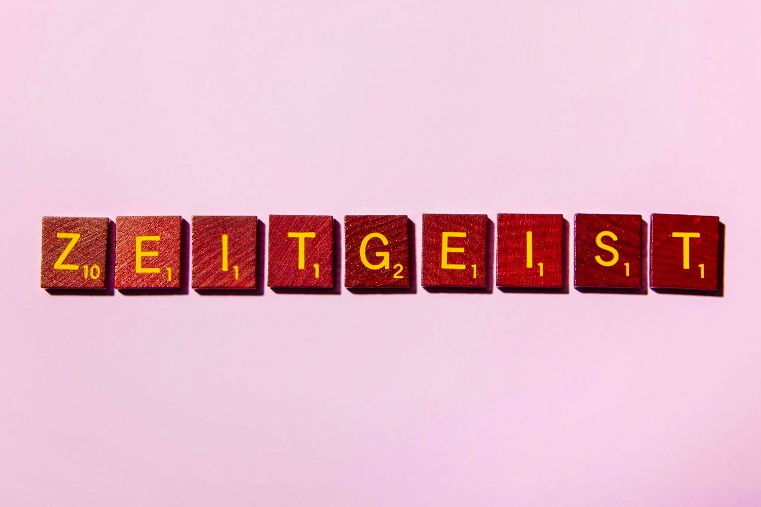 "ZEITGEIST" in scrabble letters on a pink background