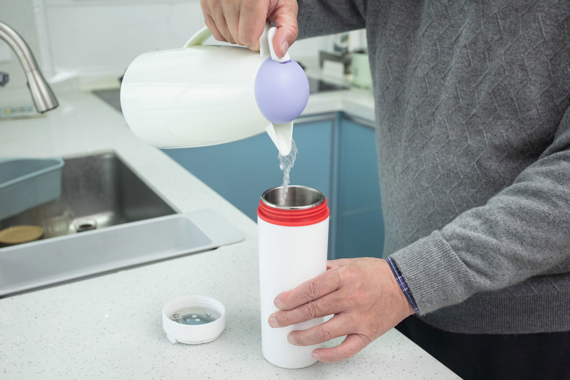 Close Up Photo Of Man Hands Pouring Hot Water Into A Cup