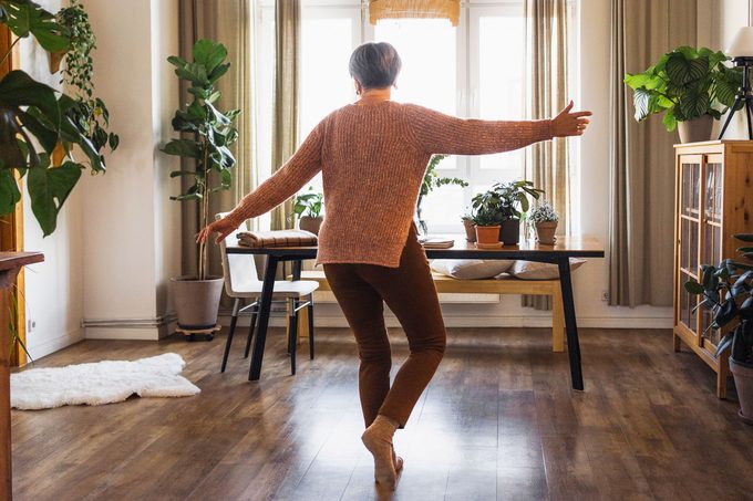 woman dancing in her house