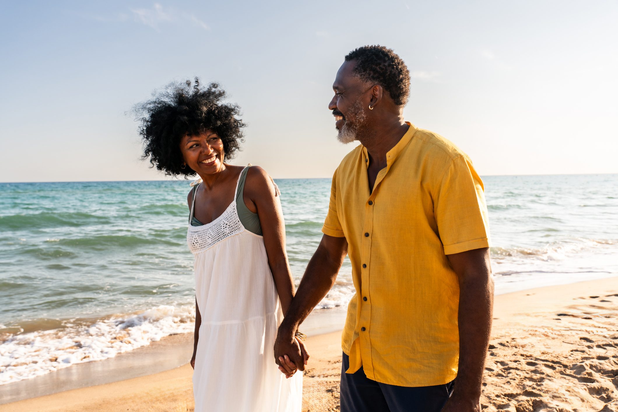 Beautiful mature black couple of lovers dating at the seaside