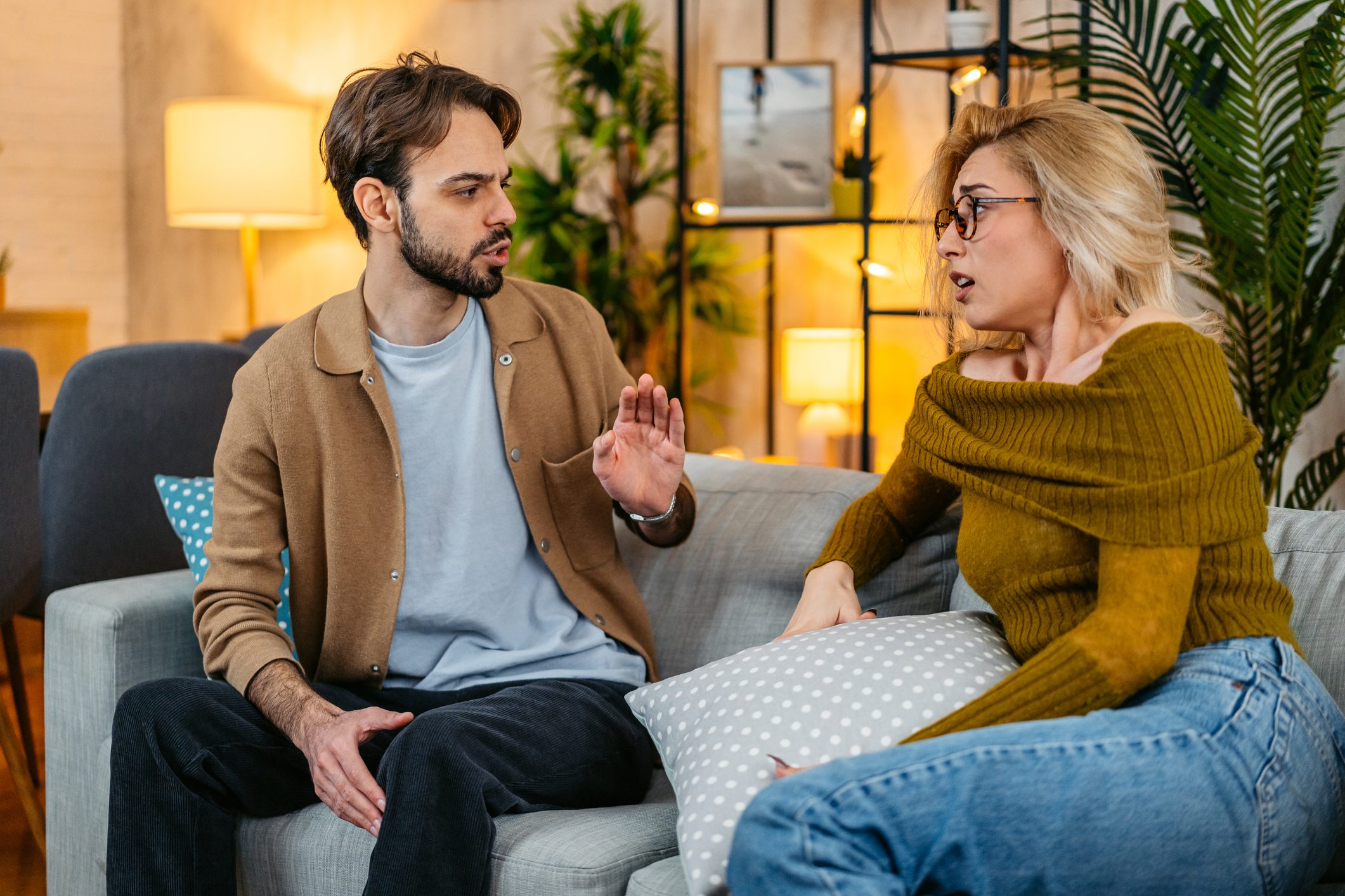 Young Couple Arguing On The Sofa At Home