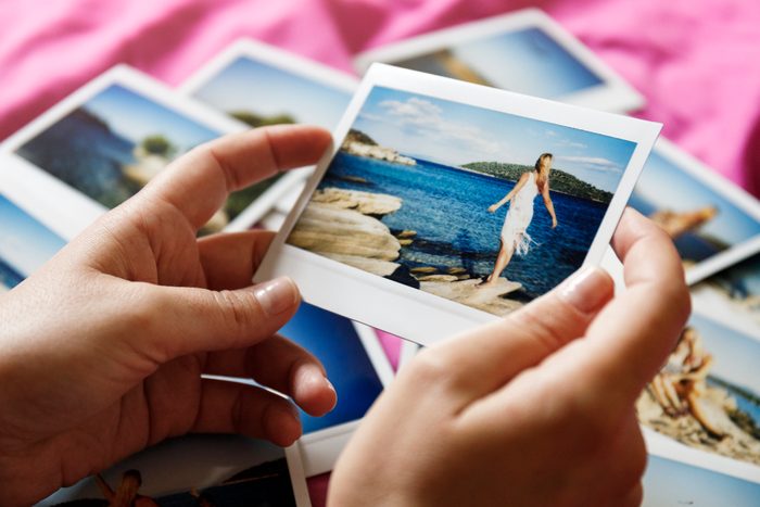 Browsing vacation photographs at home - a closeup