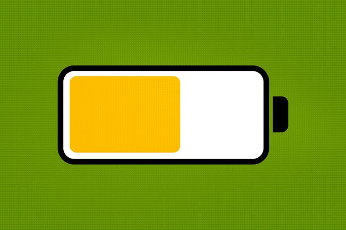 yellow low battery mode iphone battery icon on a green background