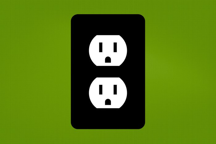 wall socket icon on a green background