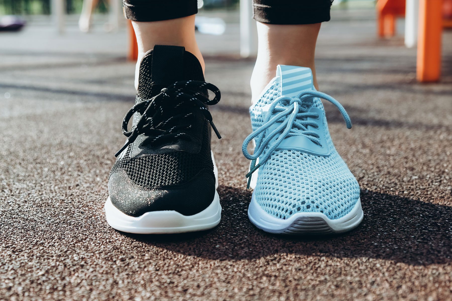 Woman wearing 2 different color shoes
