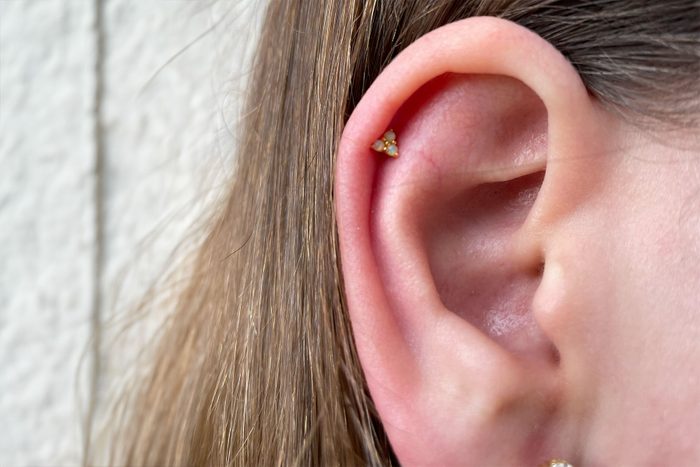 Woman wearing Opal Trio Sleeper Earrings