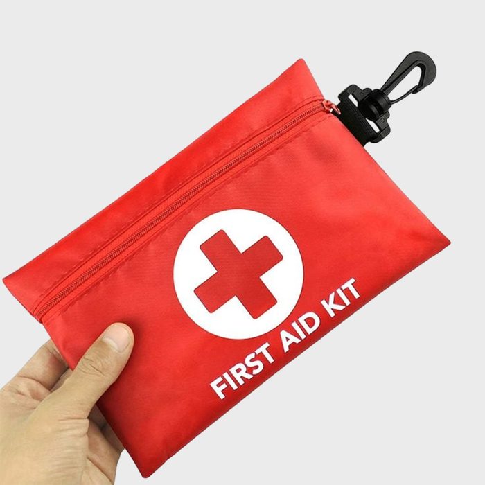 A hand with First Aid Kit