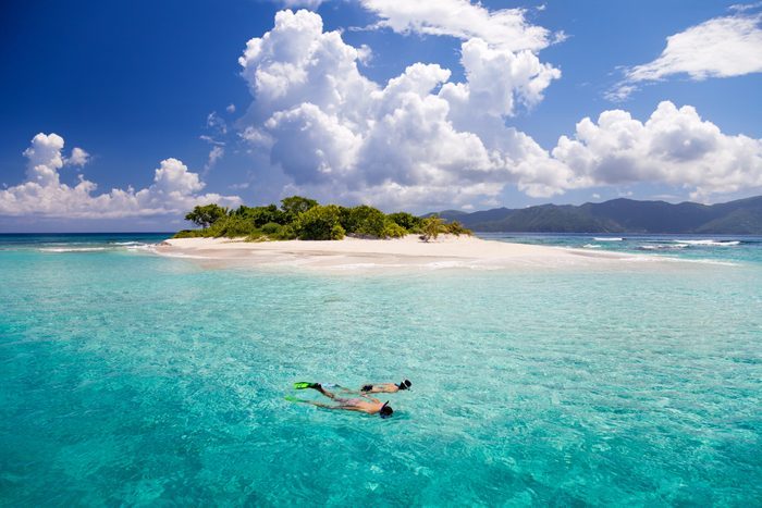 Honeymoon Couple Snorkeling By Tropical Island In The Caribbean