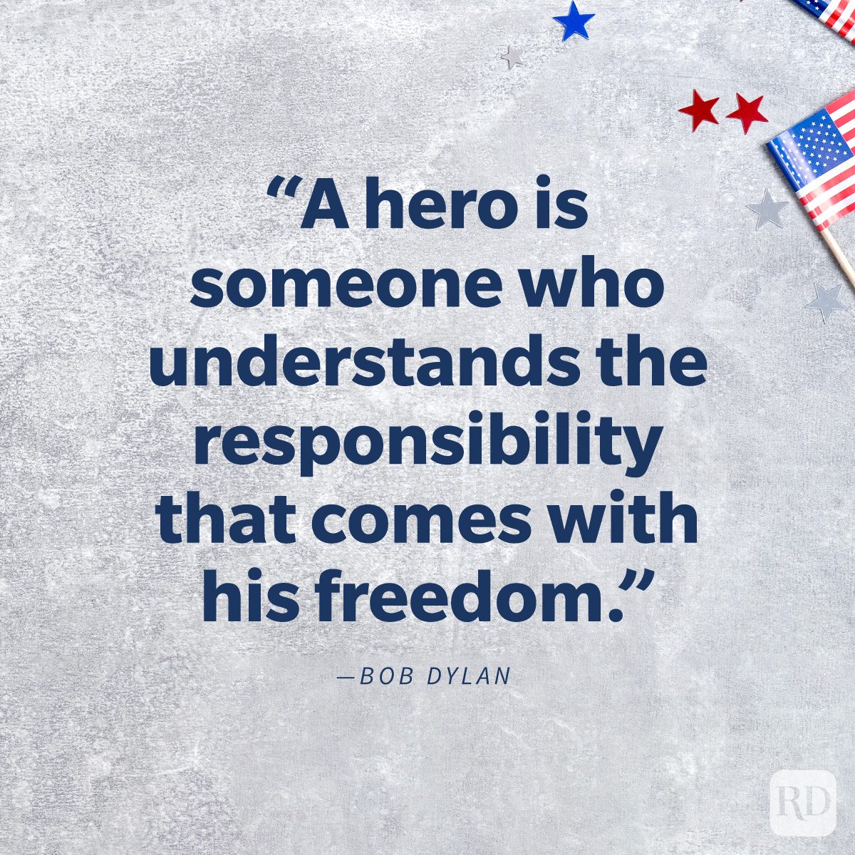 Memorial Day Quotes To Share In Honor And Remembrance “A hero is someone who understand the responsibility that comes with his freedom.” by Bob Dylan on background of flags and confetti stars on concrete stone