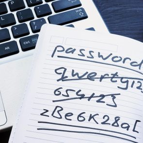 Most Common Passwords list placed on open laptop keyboard