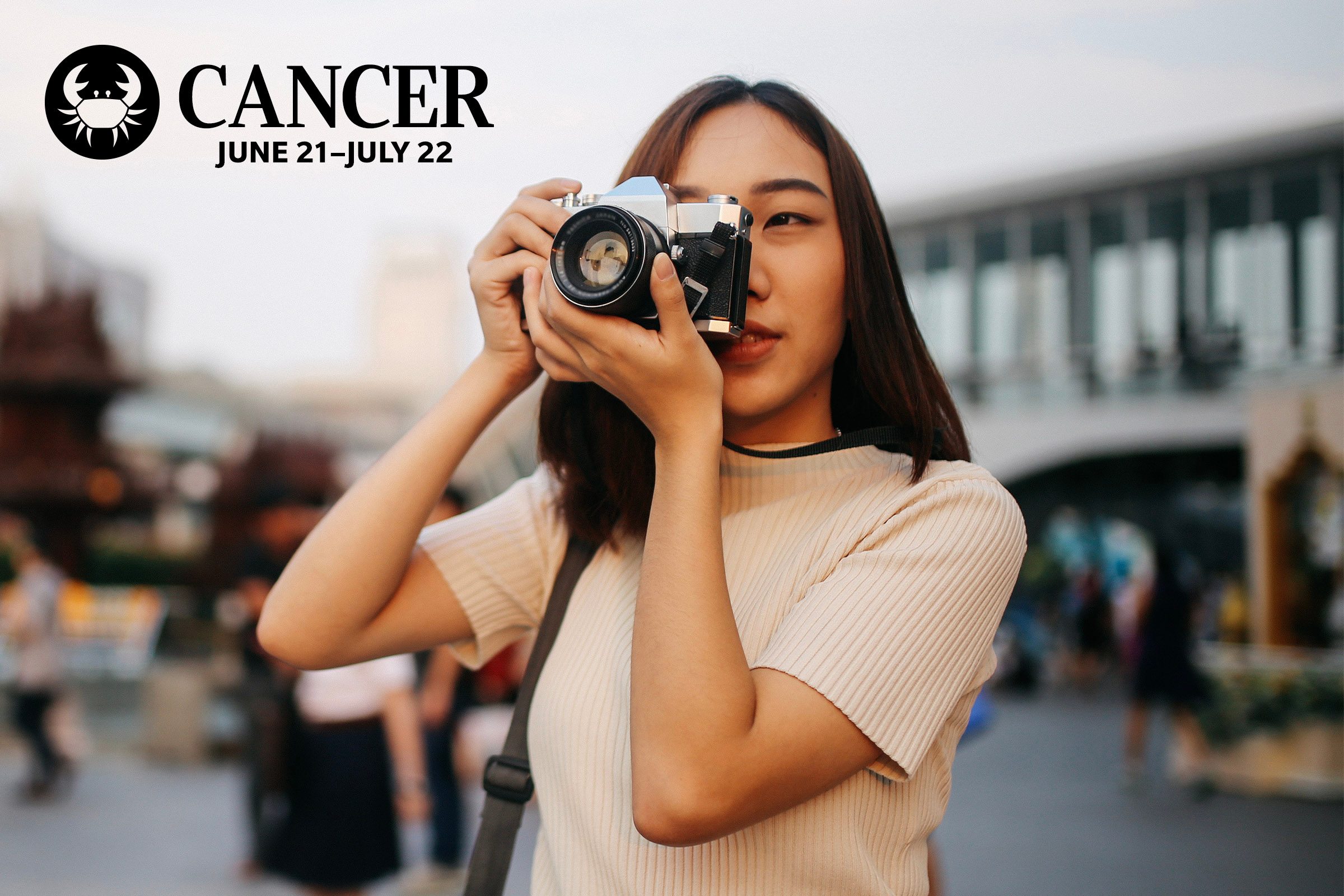 young girl taking picture with film camera