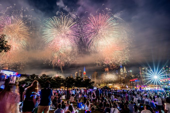 Spectators gather at Gantry Plaza State Park in Queens to watch to 2022 Macy's fireworks display on July 04, 2022 in New York City.