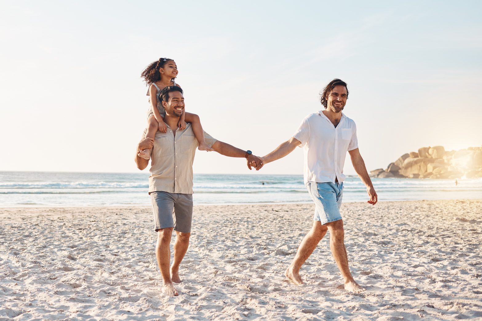 Lgbt parents on beach, men and child holding hands in summer, walking and island holiday together. Love, happiness and sun, gay couple on tropical ocean vacation with daughter on piggy back mockup.