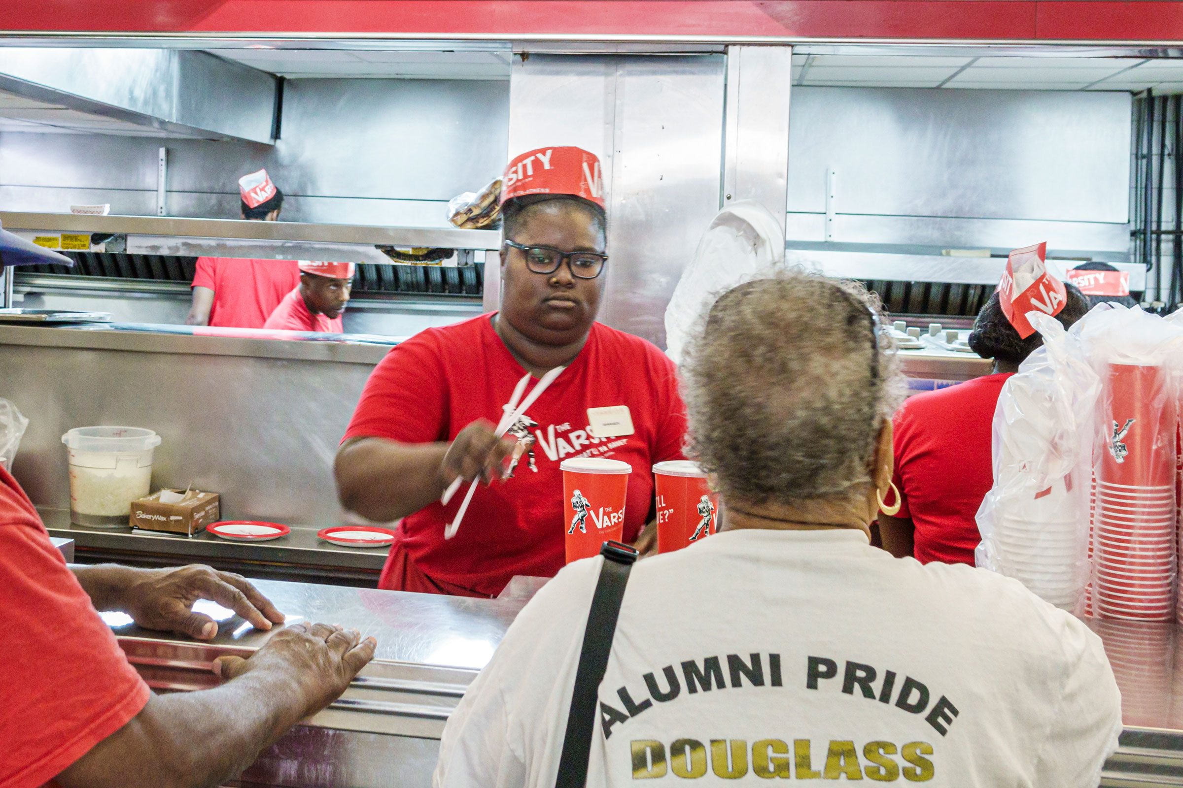 fast food employee hanging customer straws