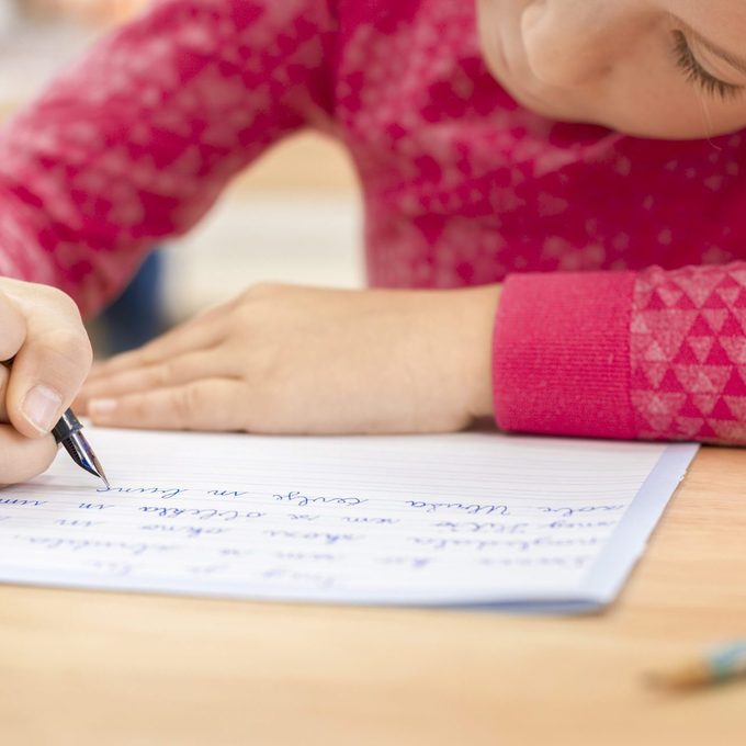 Girl writing in notebook