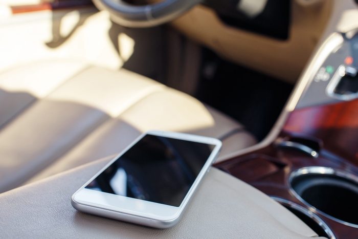 smart phone phone on the car seat dashboard