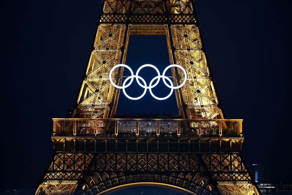 Close up on the Eiffel Tower bearing the Olympics rings, lit-up ahead of the Paris 2024 Olympic and Paralympic games, in Paris on July 20, 2024.