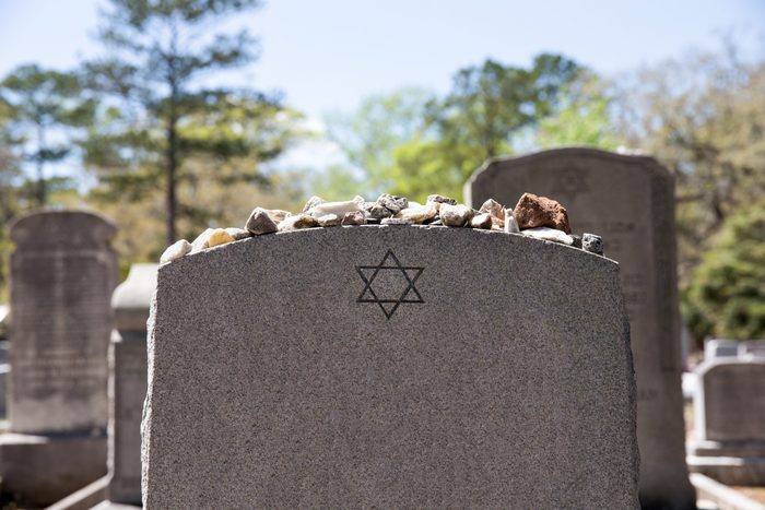 Headstone in Jewish Cemetery with Star of David and Memory Stones