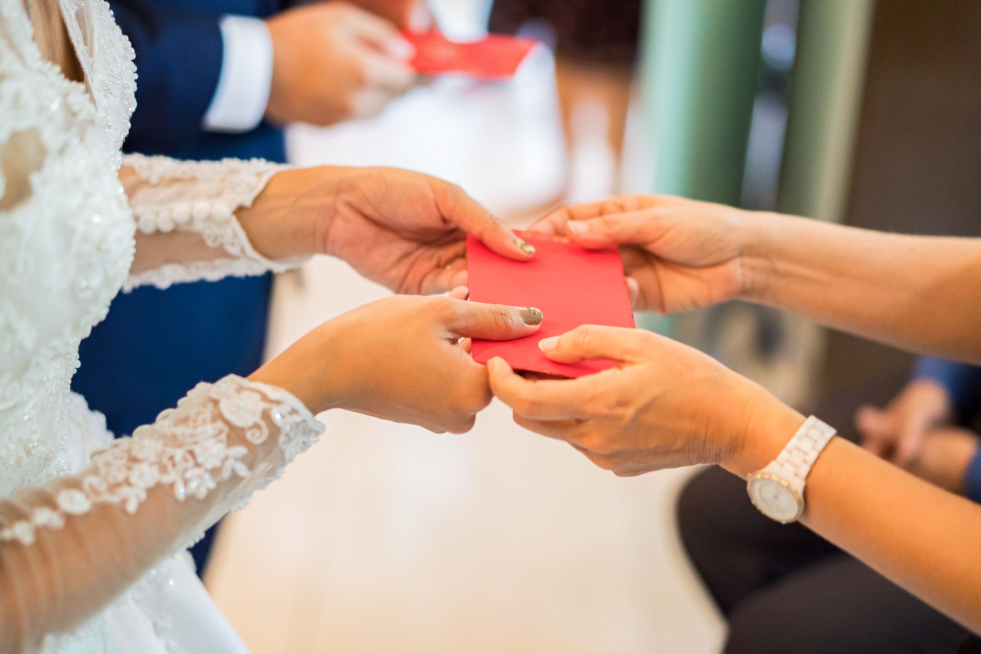 Elders Giving Red Packet To Newlywed Couple