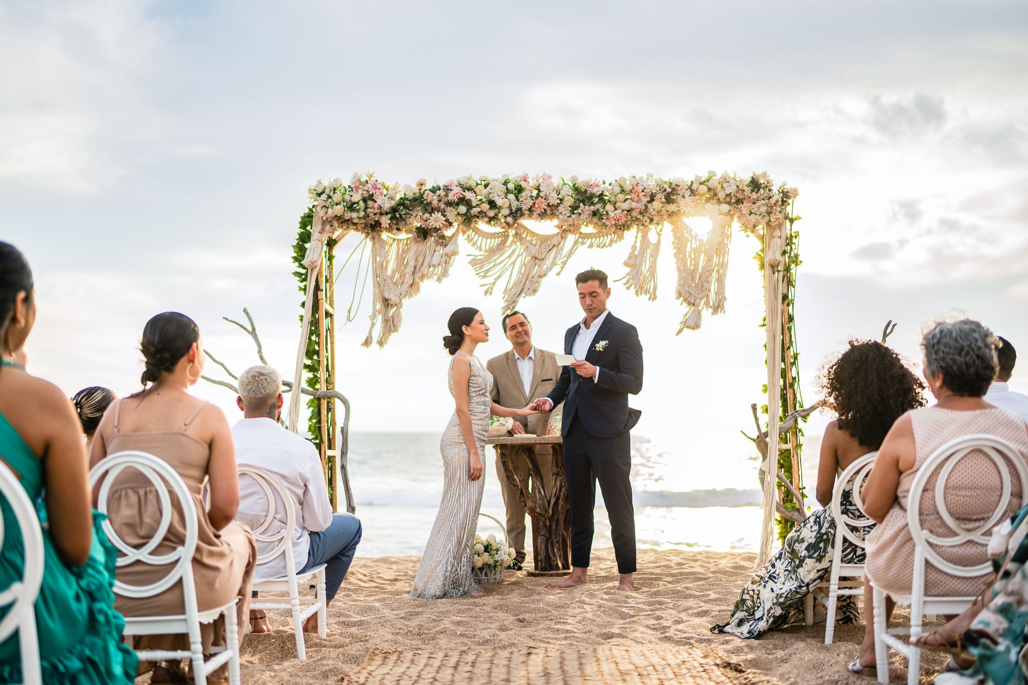 Groom Speaking Vows To His Bride In The Wedding Ceremony On The Beach