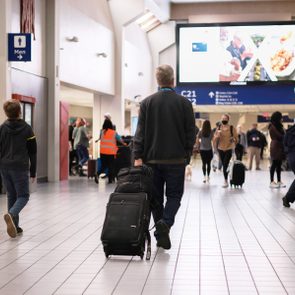 People walk through the Dallas/Fort Worth International Airport