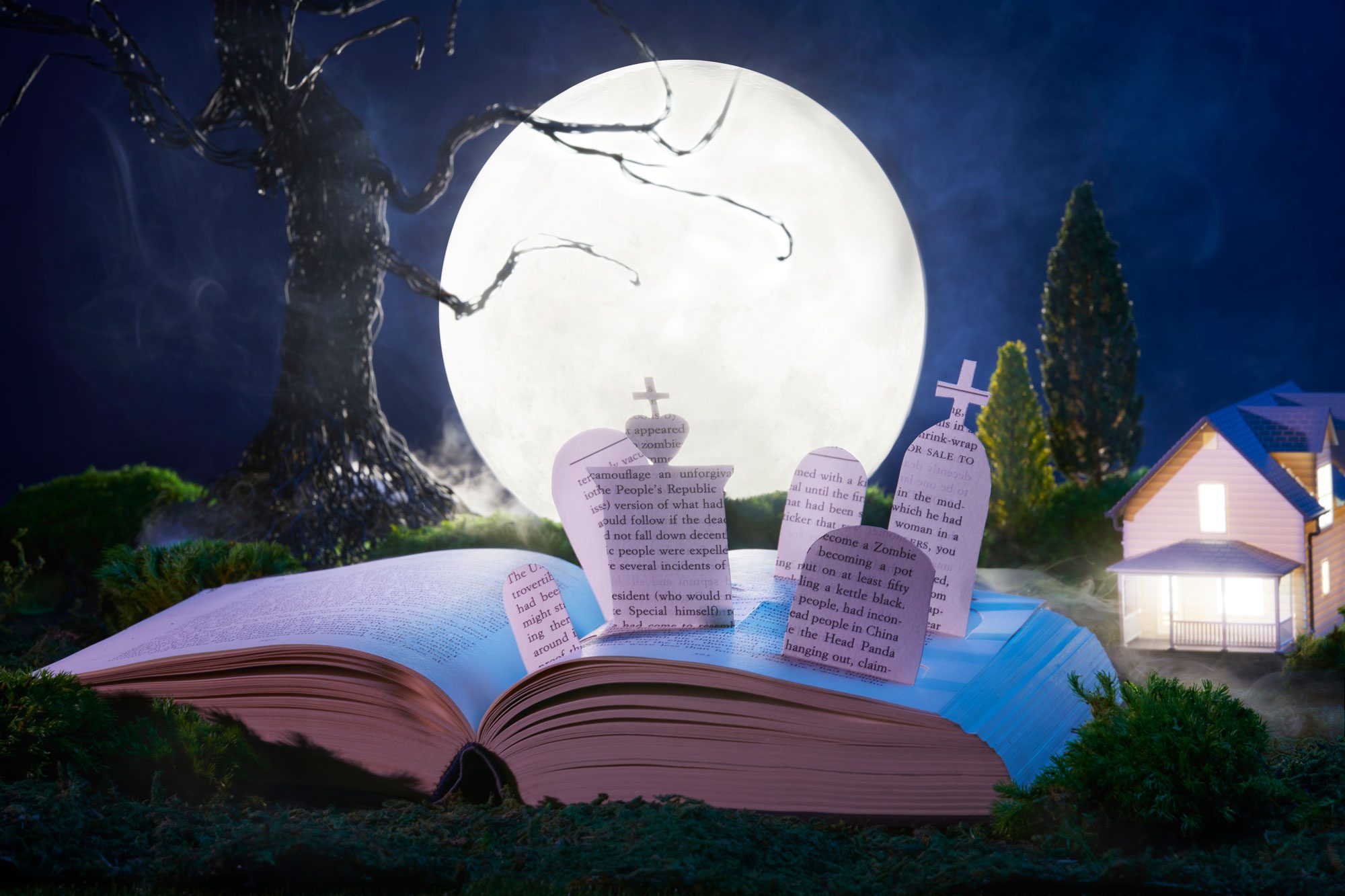 A graveyard rises out of the pages of a horror novel. In the background is a spooky tree, full moon, house. Foggy atmosphere.