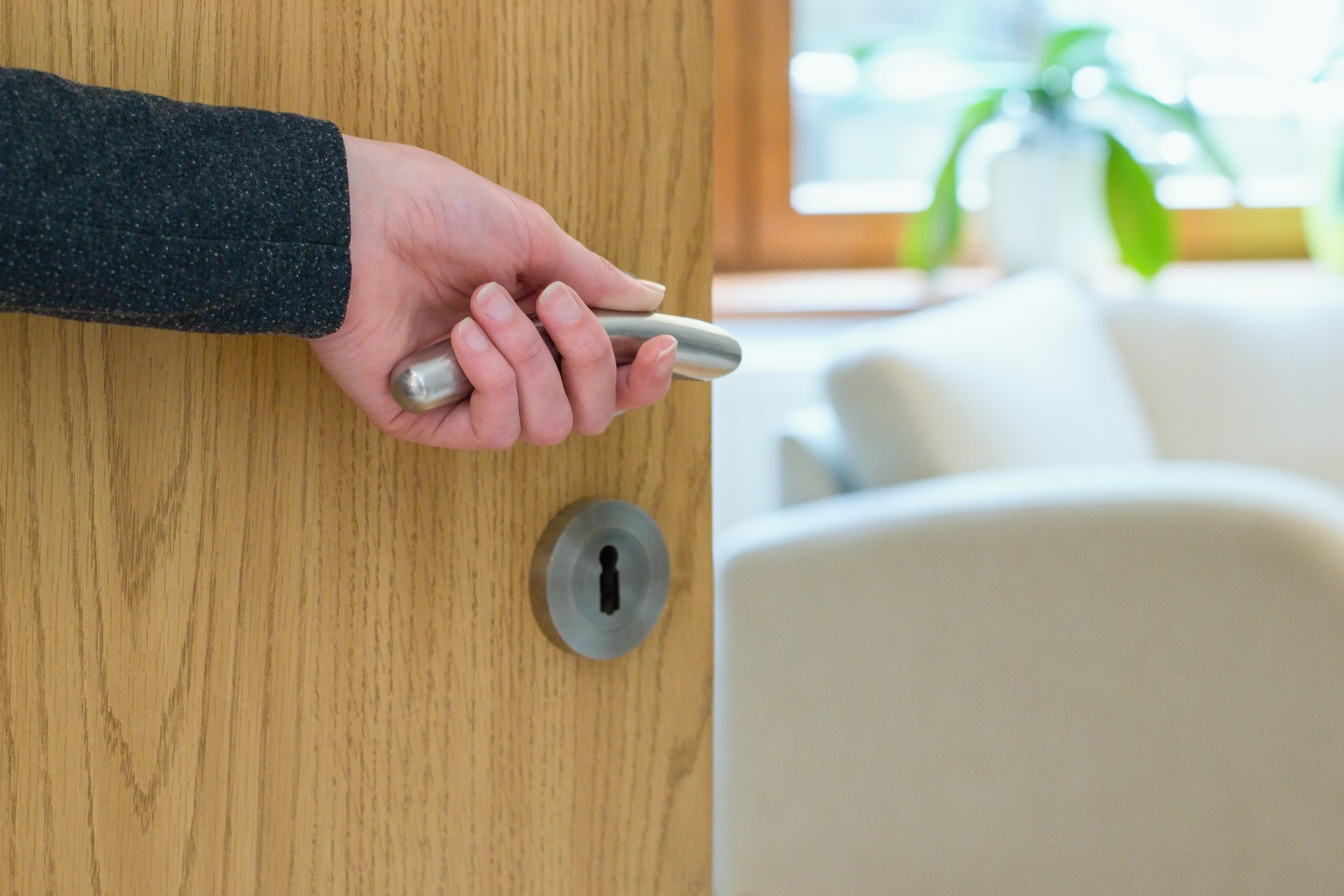 Woman opening door of the bathroom