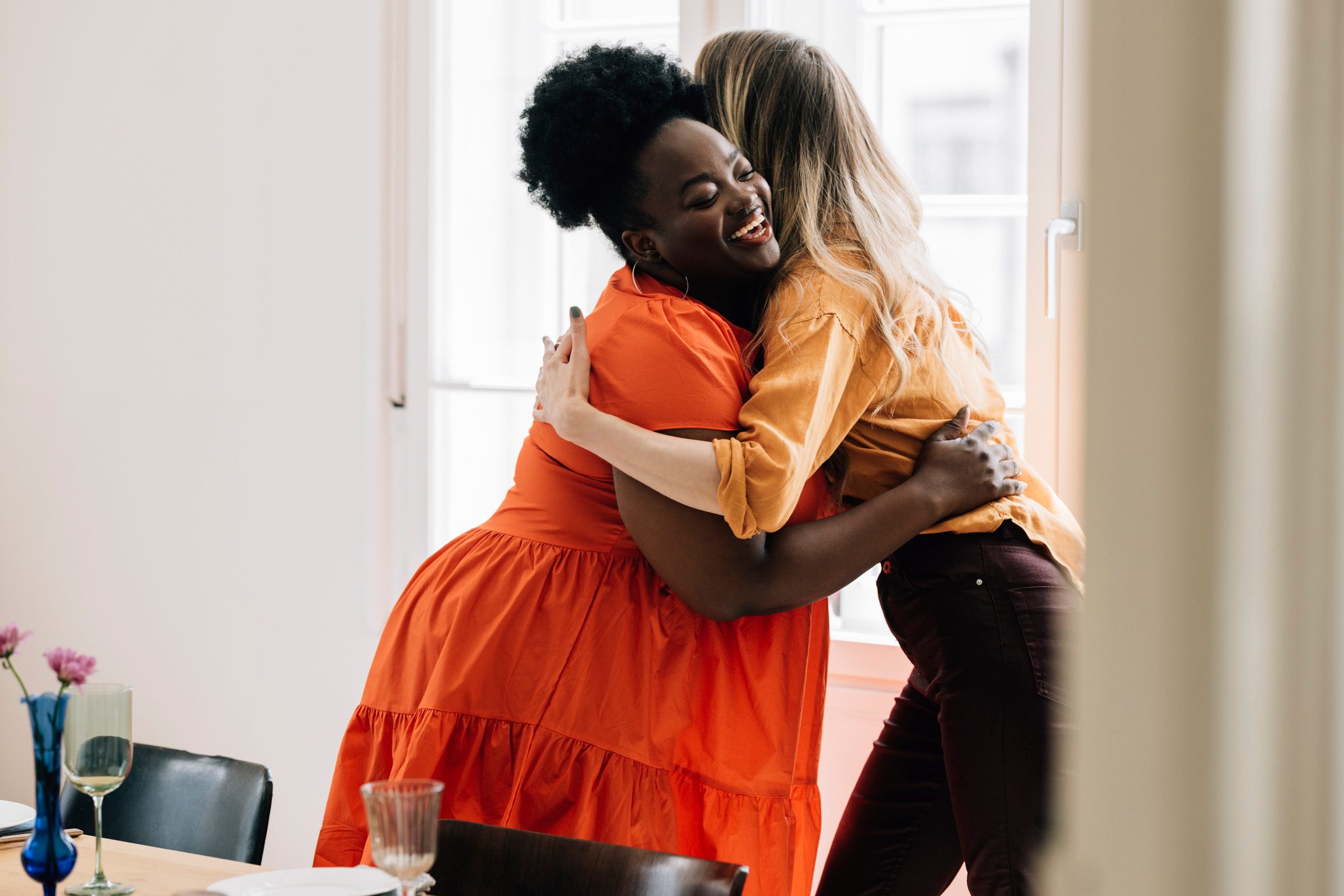 Two Diverse Friends Being Happy To Meet After A While And Embracing Each Other