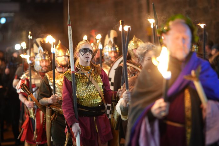 Re-enactors from the Roman Deva Victrix 20th Legion parade through the city of Chester as they celebrate the ancient Roman festival of Saturnalia on December 14, 2023 in Chester, England.