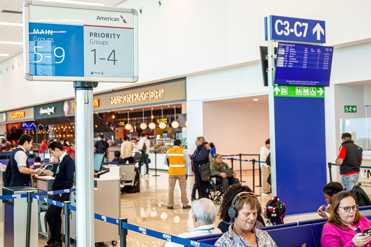 Merida, Mexico, Manuel Crescencio Rejon International Airport, Merida International Airport, American Airlines sign boarding, main priority, travelers waiting.