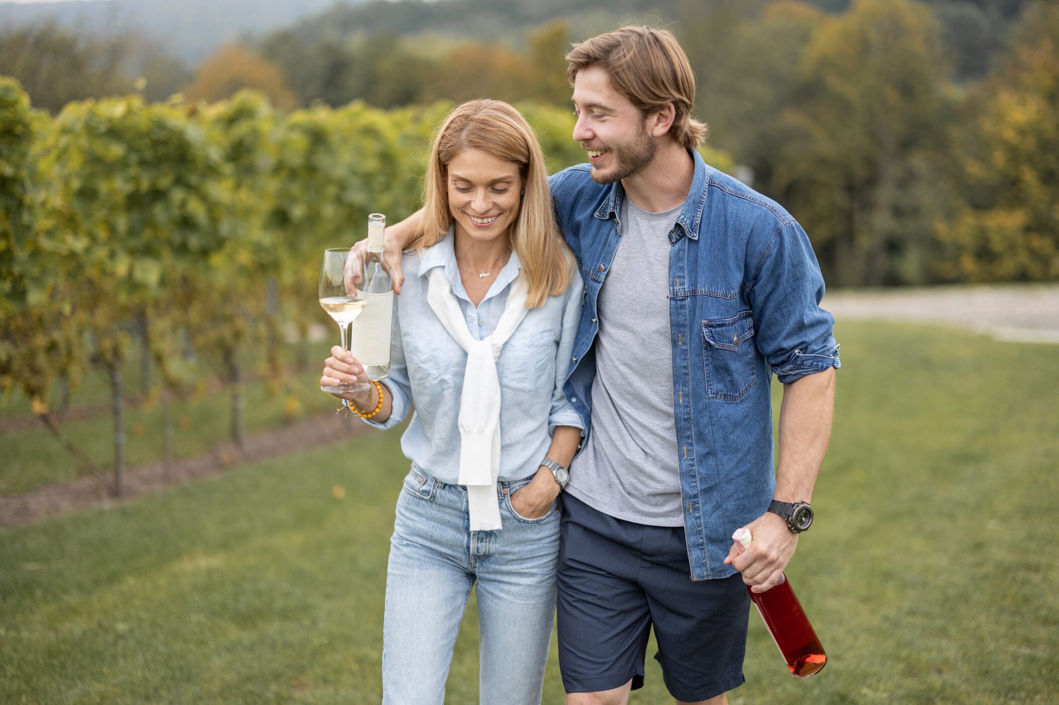 Couple walking near vineyards in countryside