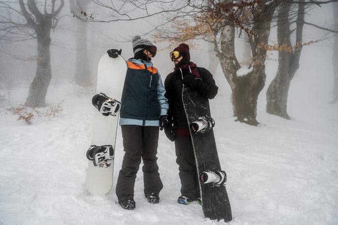 Couple of snowboarders enjoying on the mountain