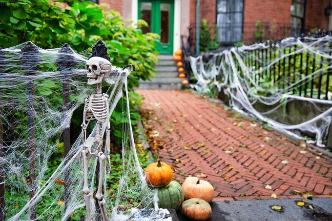 Skeleton and spiderweb decor for Halloween.