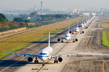 A Large Number Of Aircraft Sliding In A Line For Take Off