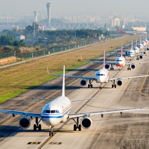 A Large Number Of Aircraft Sliding In A Line For Take Off