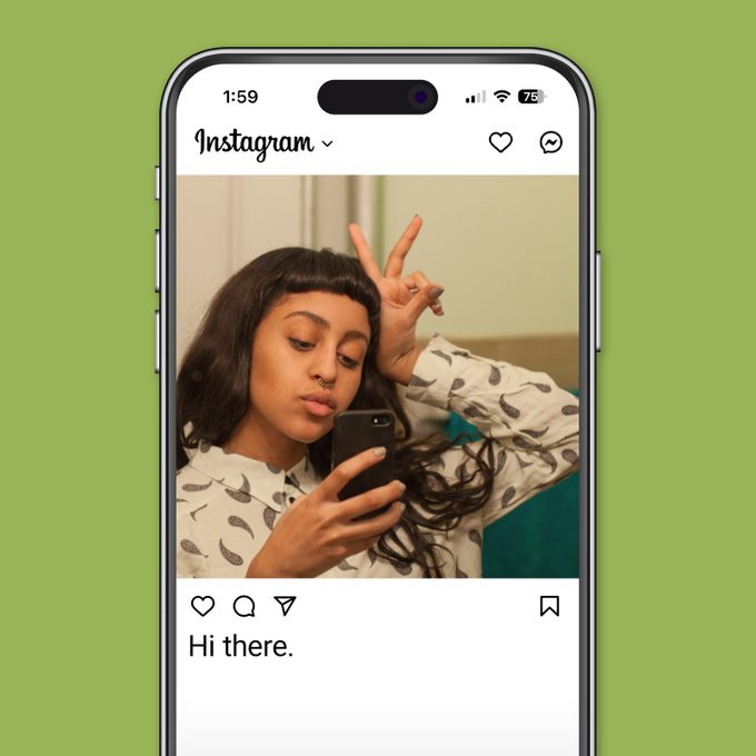 Best Selfie Captions For Gram Worthy Pictures Young woman taking a selfie in her bathroom mirror Instagram app on green background