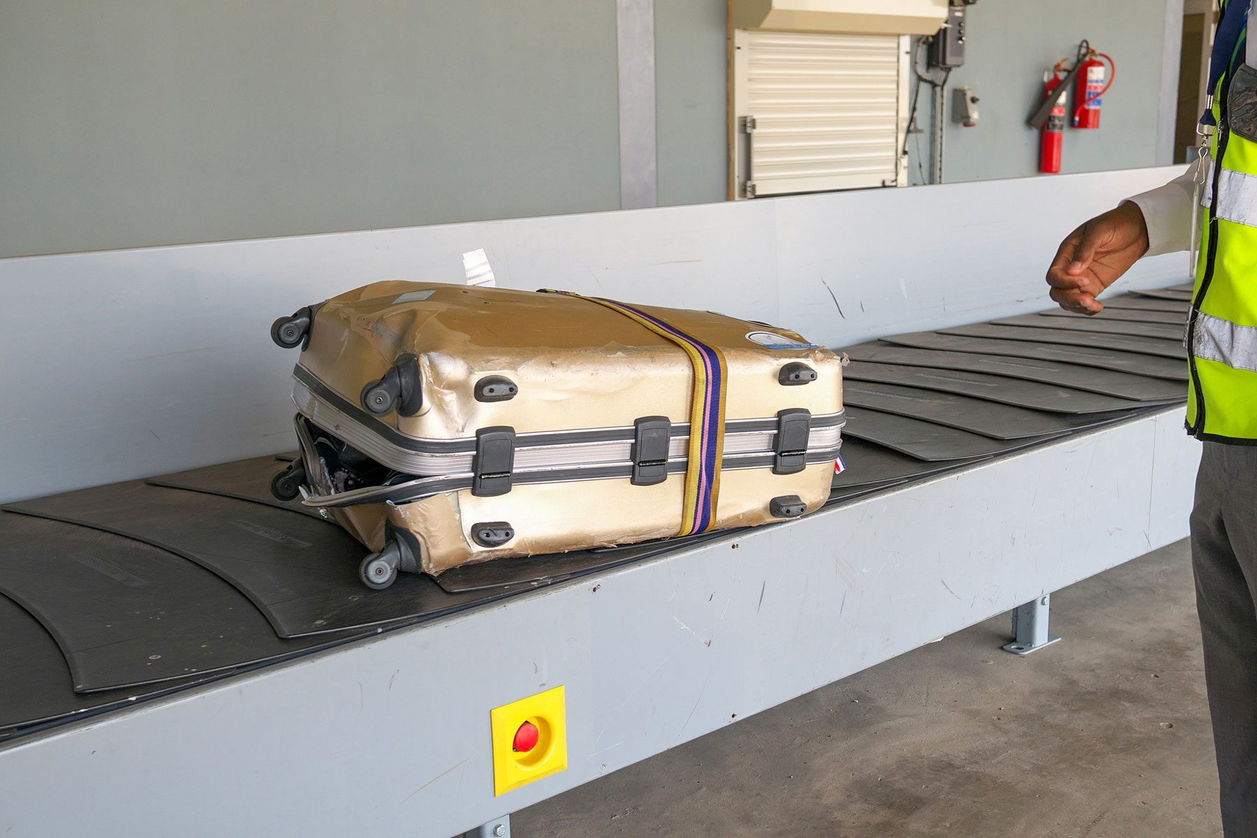 A completely broken suitcase due to poor handling at an airport