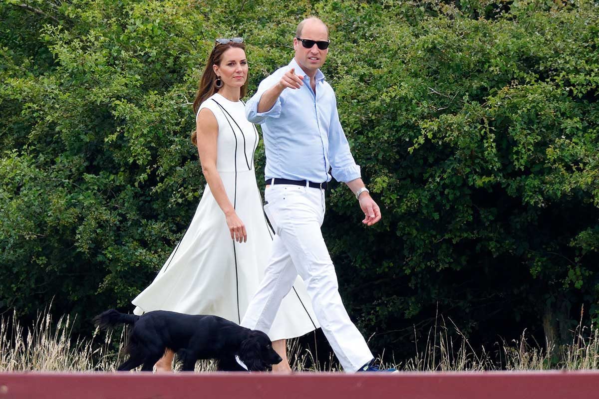 Catherine, Duchess of Cambridge and Prince William, Duke of Cambridge, with their dog 'Orla', attend the Out-Sourcing Inc. Royal Charity Polo Cup at Guards Polo Club, Flemish Farm on July 6, 2022 in Windsor, England.