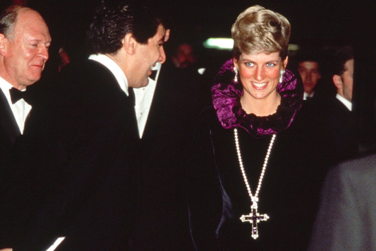 Diana, Princess Of Wales, Arriving At A Charity Gala Evening On Behalf Of Birthright At Garrard. The Princess Is Wearing A Purple Evening Dress With A Gold And Amethyst Crucifix Suspended On A Pearl Rope. (Photo by Tim Graham Photo Library via Getty Images)