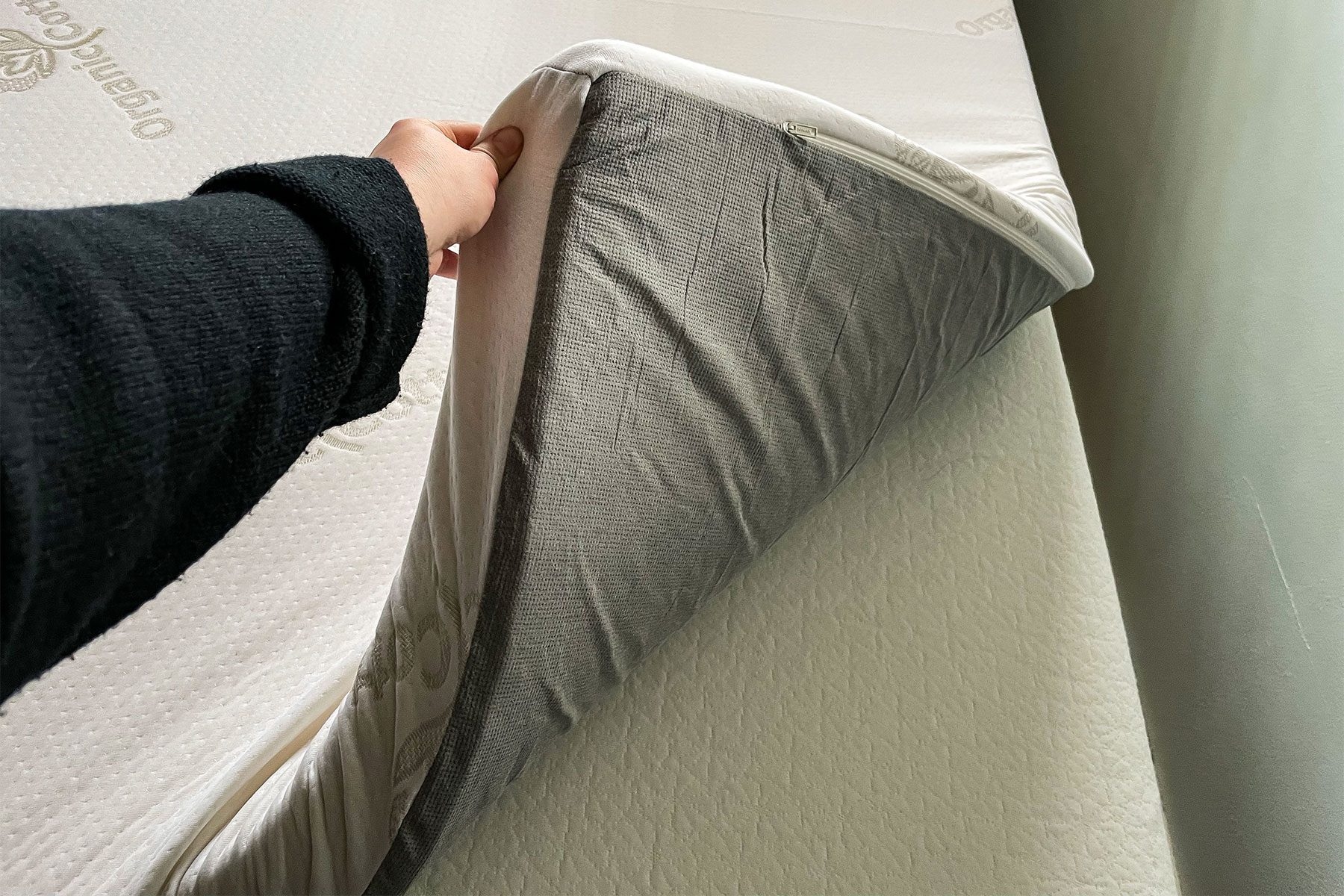 Brooklyn Bedding latex topper being lifted from a corner