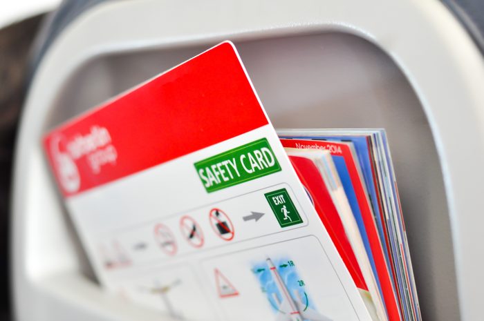 Safety card instructions in an airplane