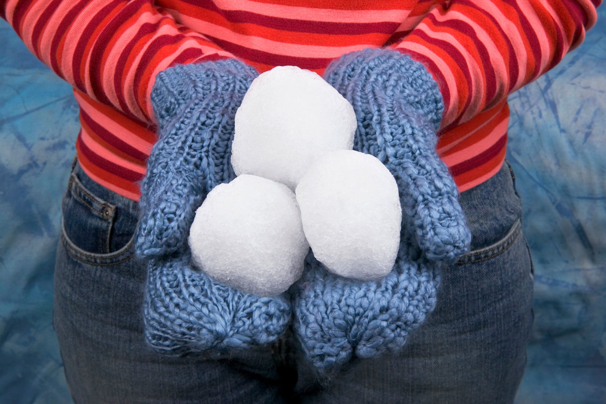 Woman In Mittens Holding Snowballs