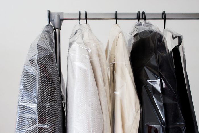 Dry cleaned clothes on rack