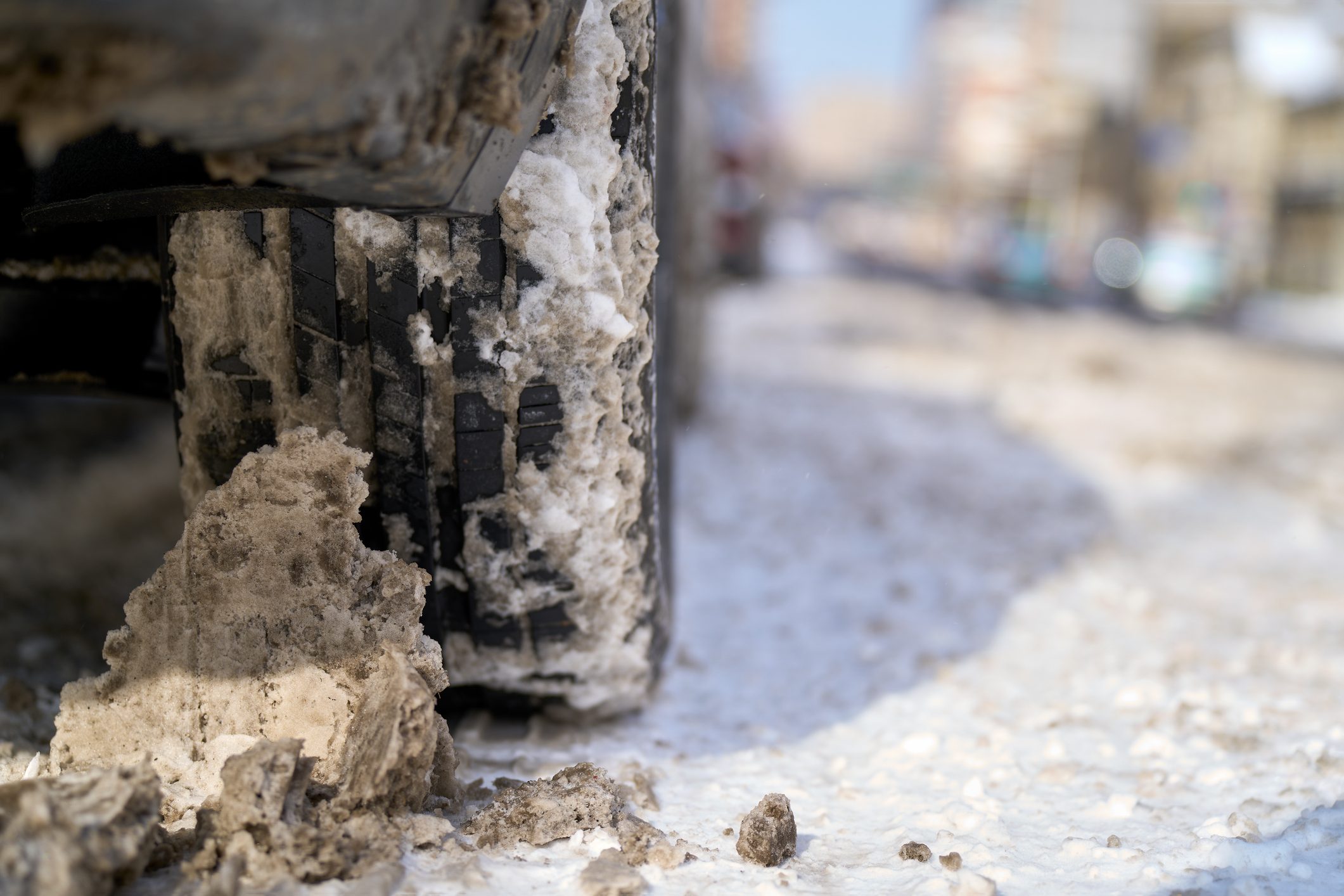 Car wheels on muddy snow