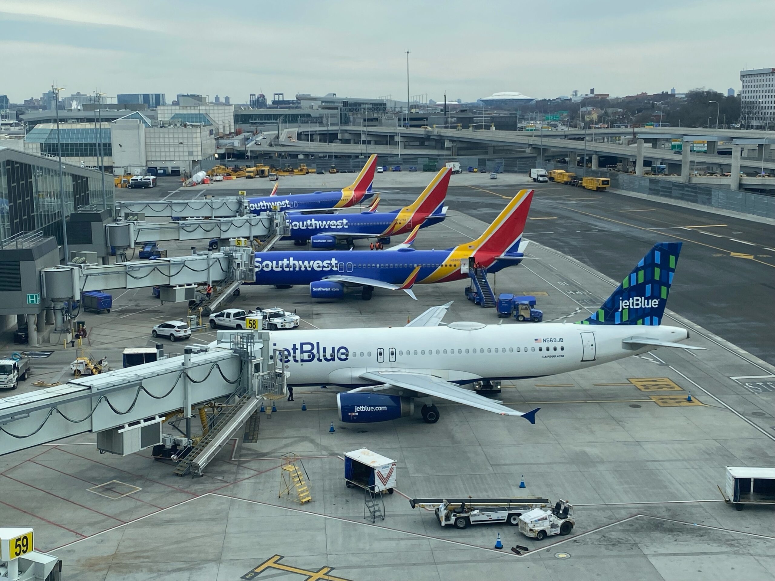 JetBlue and Southwest airplanes parked at their gates