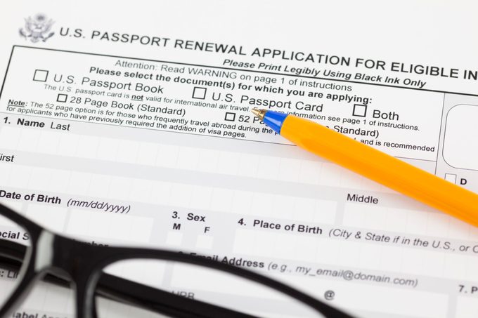 U.S. Passport renewal application with a pen and eyeglasses